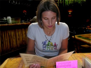 girl reading a menu